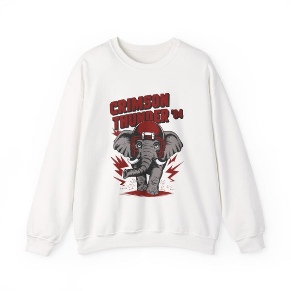 White crewneck sweatshirt with a large red and gray "Crimson Thunder" elephant mascot graphic wearing a football helmet and a white eye-mask. The elephant is depicted with red lightning bolts around it, and the design has a vintage, worn look.